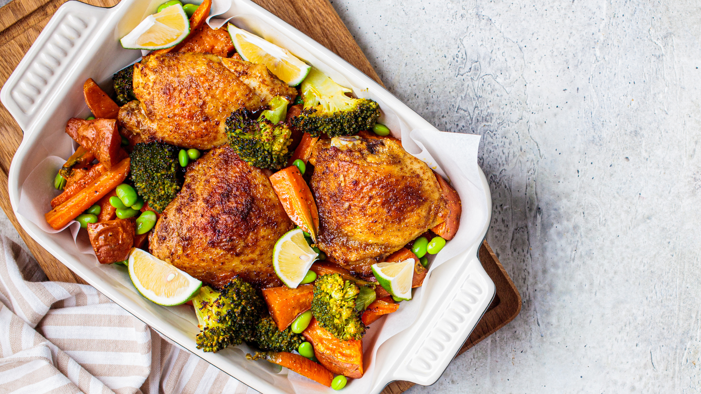 chicken and vegetables in a roasting pan