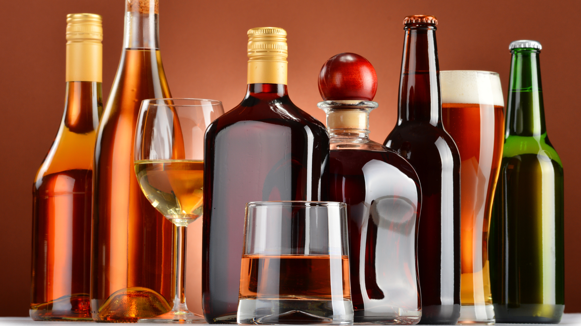 bottles and glasses of beer, wine, and liquor