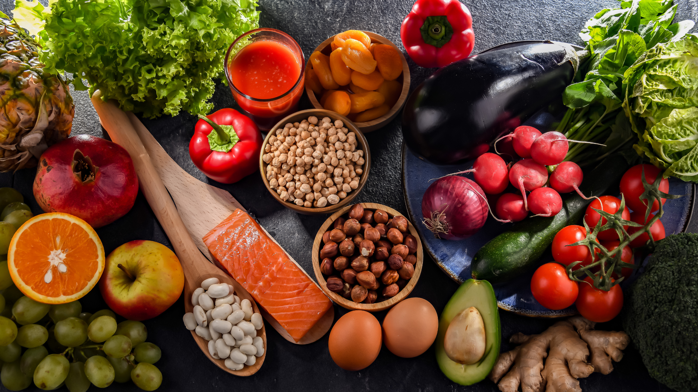 top-down view of fresh fruits, nuts, and vegetables