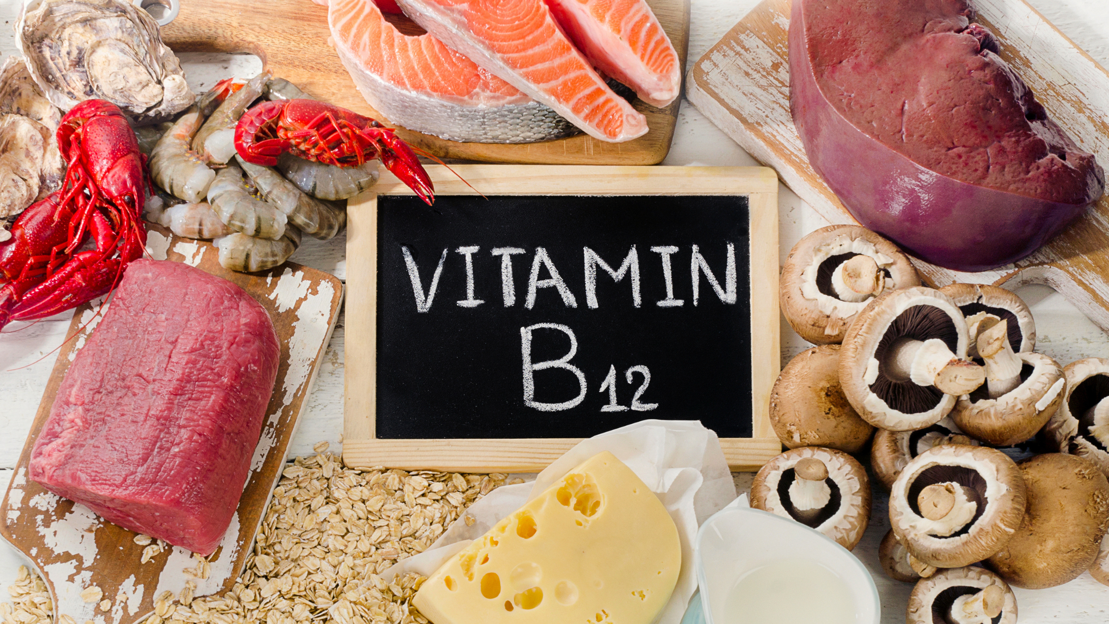 blackboard saying 'vitamin b12' surrounded by seafood, meat, cheese