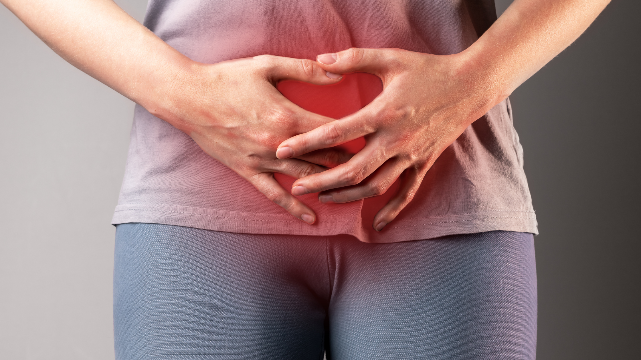 woman clutching her stomach over bladder