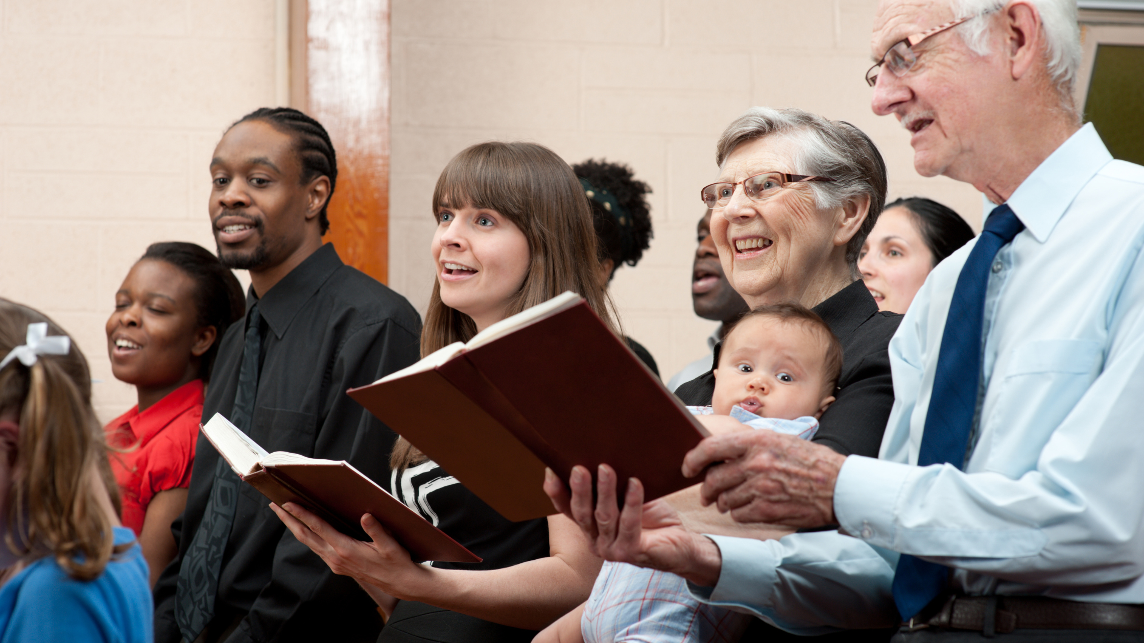 diverse group of people singing together