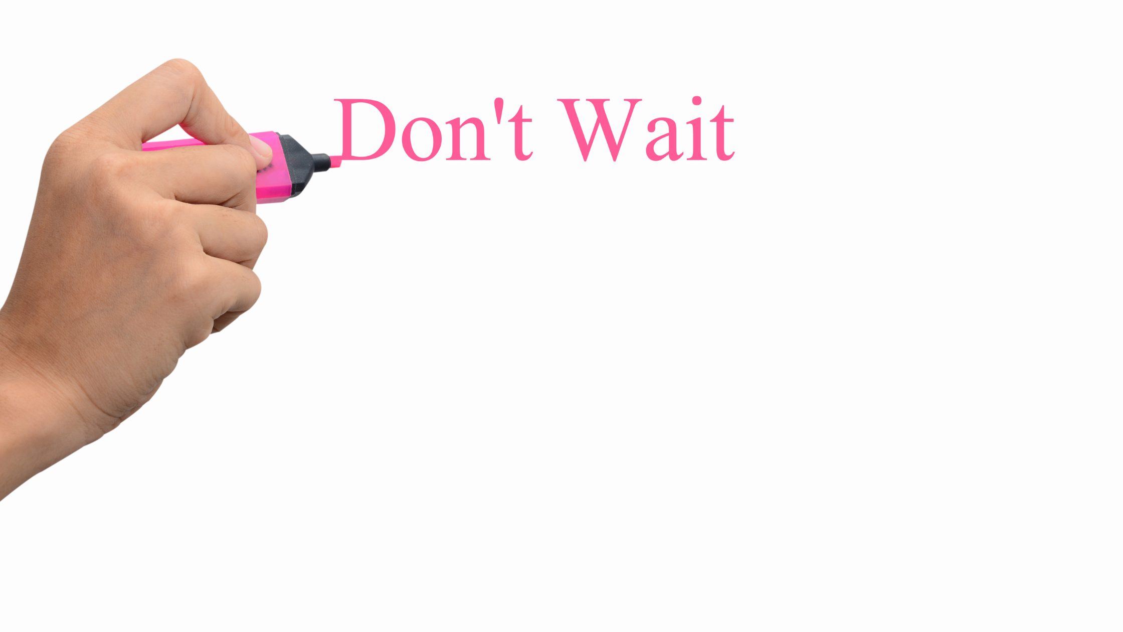 human hand writing "don't wait" in pink highlighter