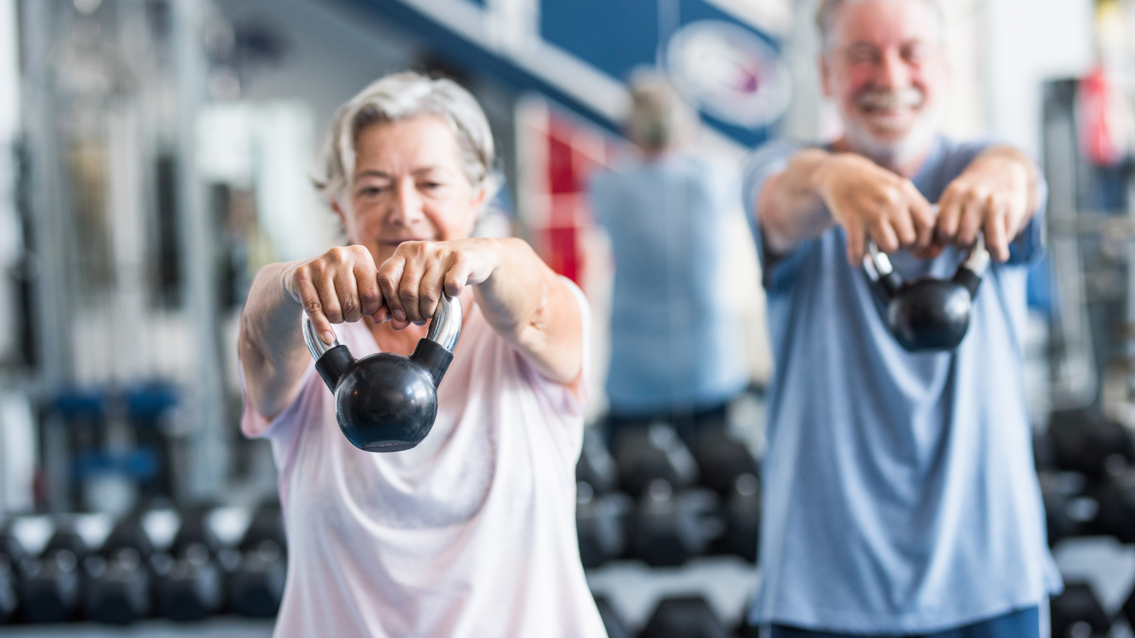 row of people running on treadmills