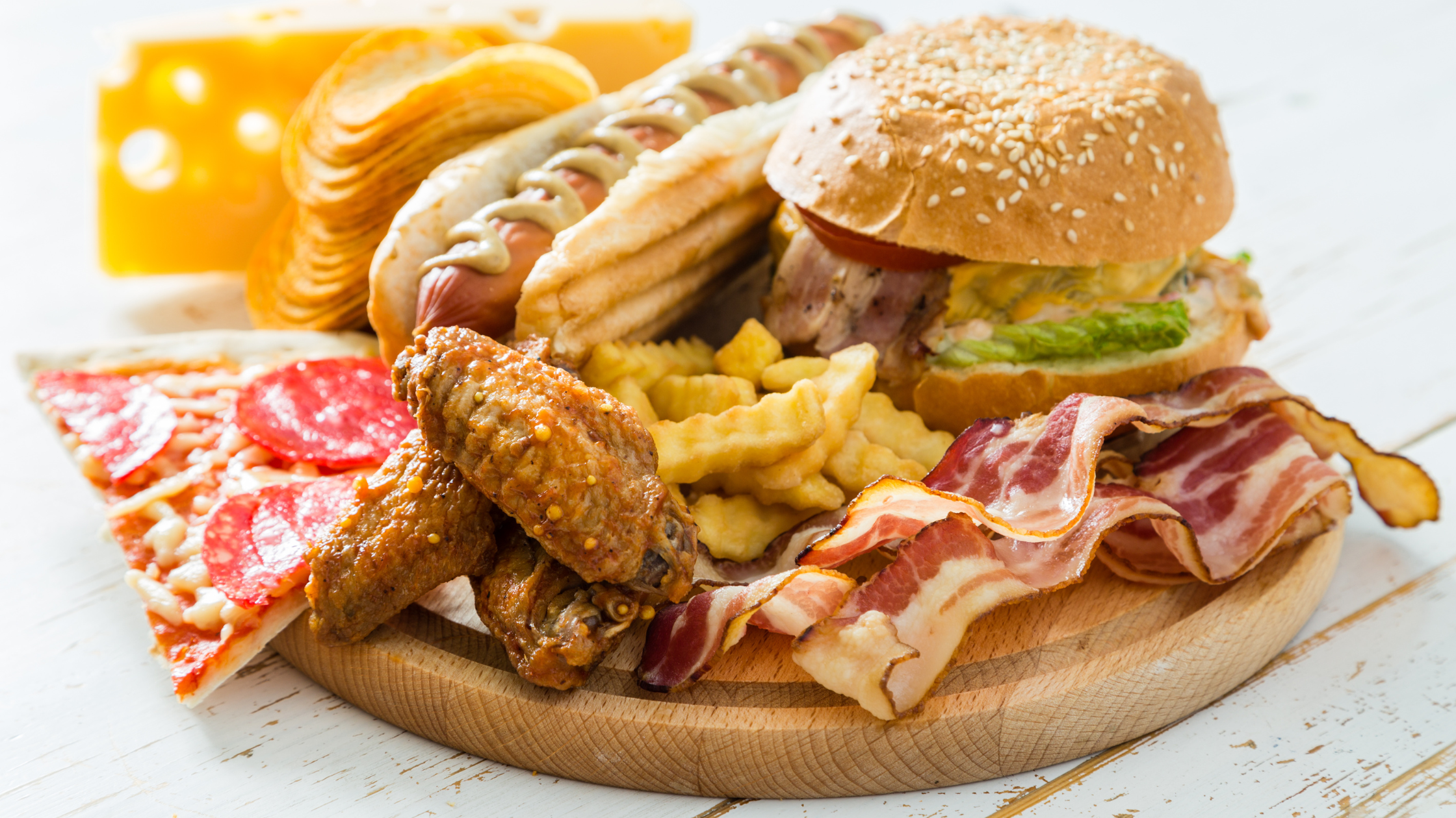 big plate of fried foods and pizza