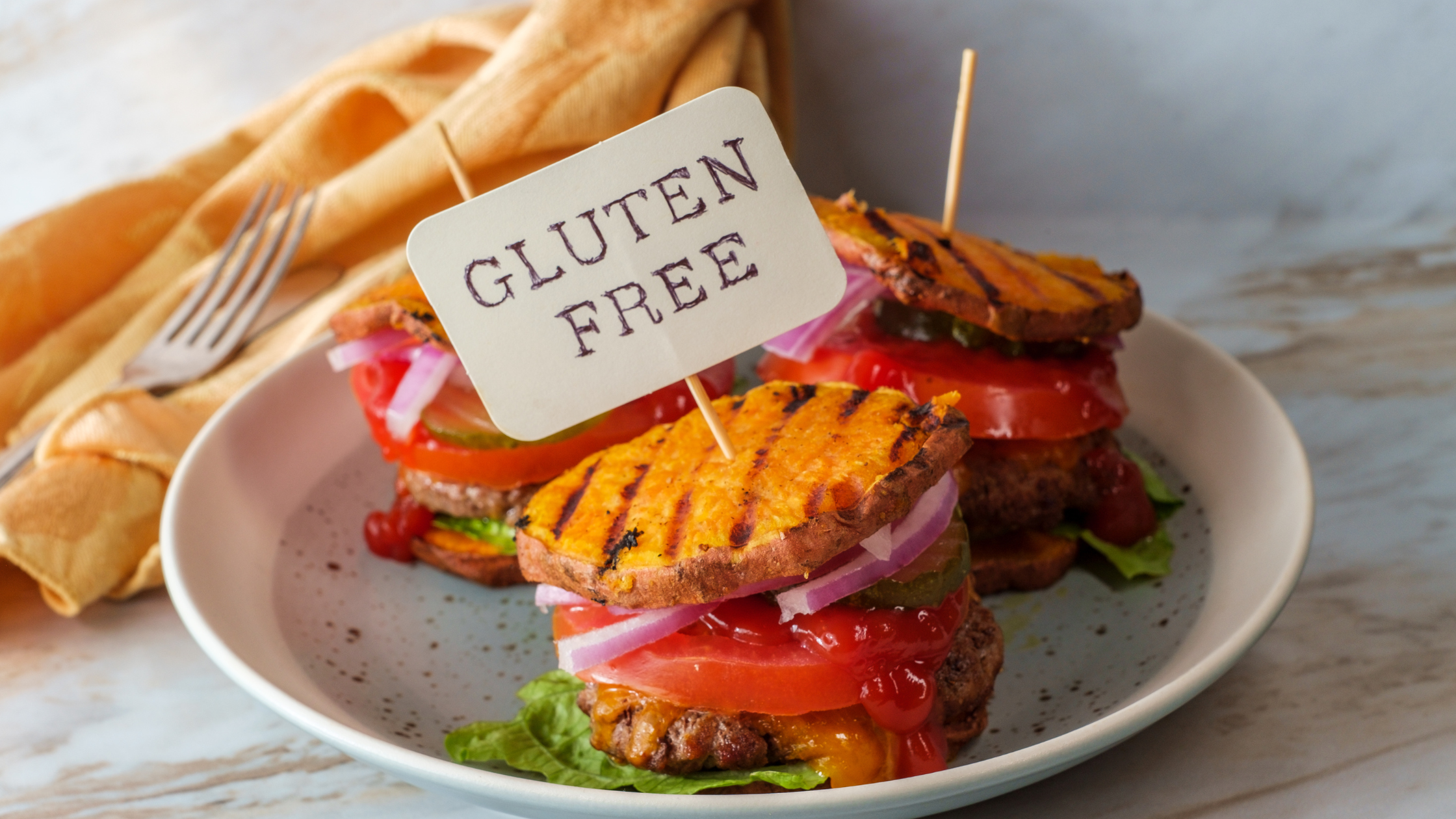 burgers on a plate with a sign that says "gluten free"