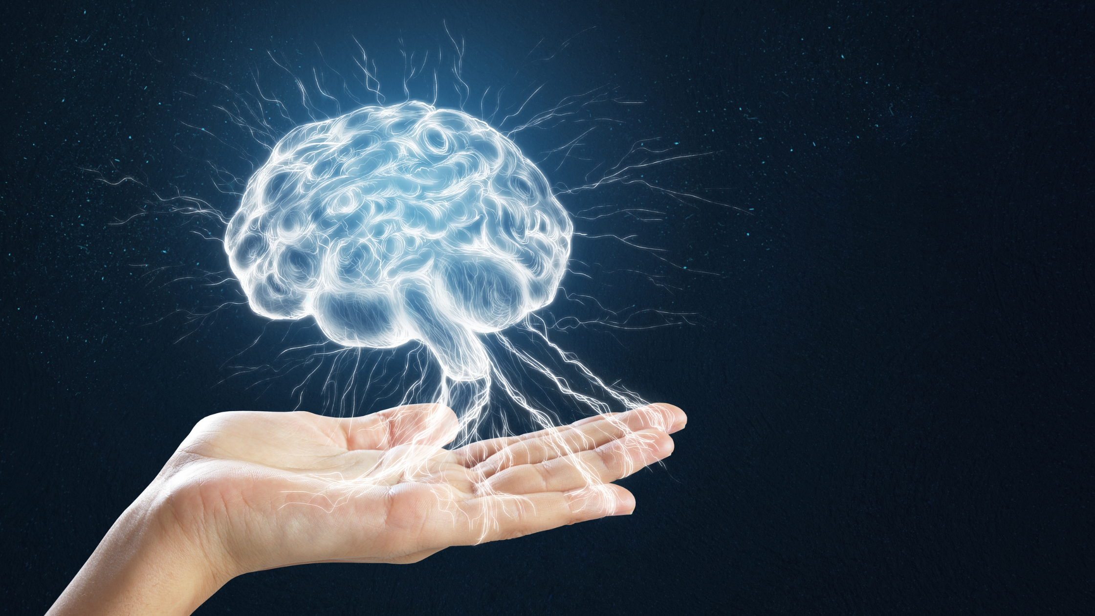 illustration of a glowing human brain floating over an open palm