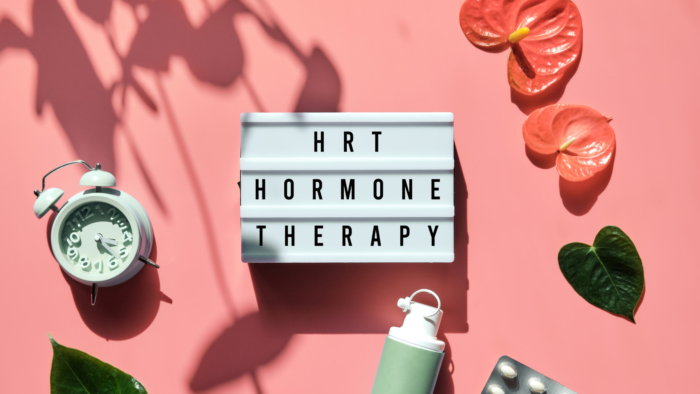 sign saying "HRT Hormone replacement therapy" surrounded by flowers and pills