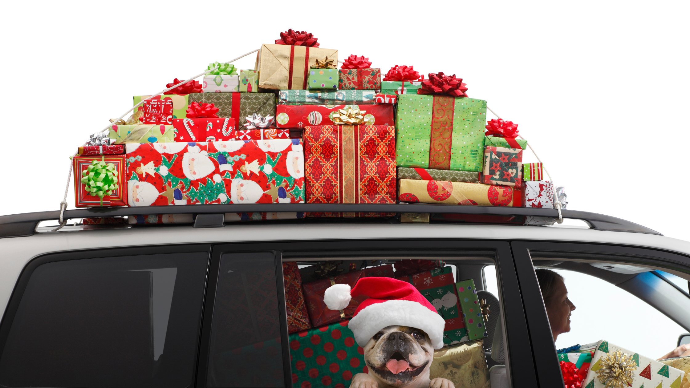 car packed to the brim with wrapped gifts and another pile on top