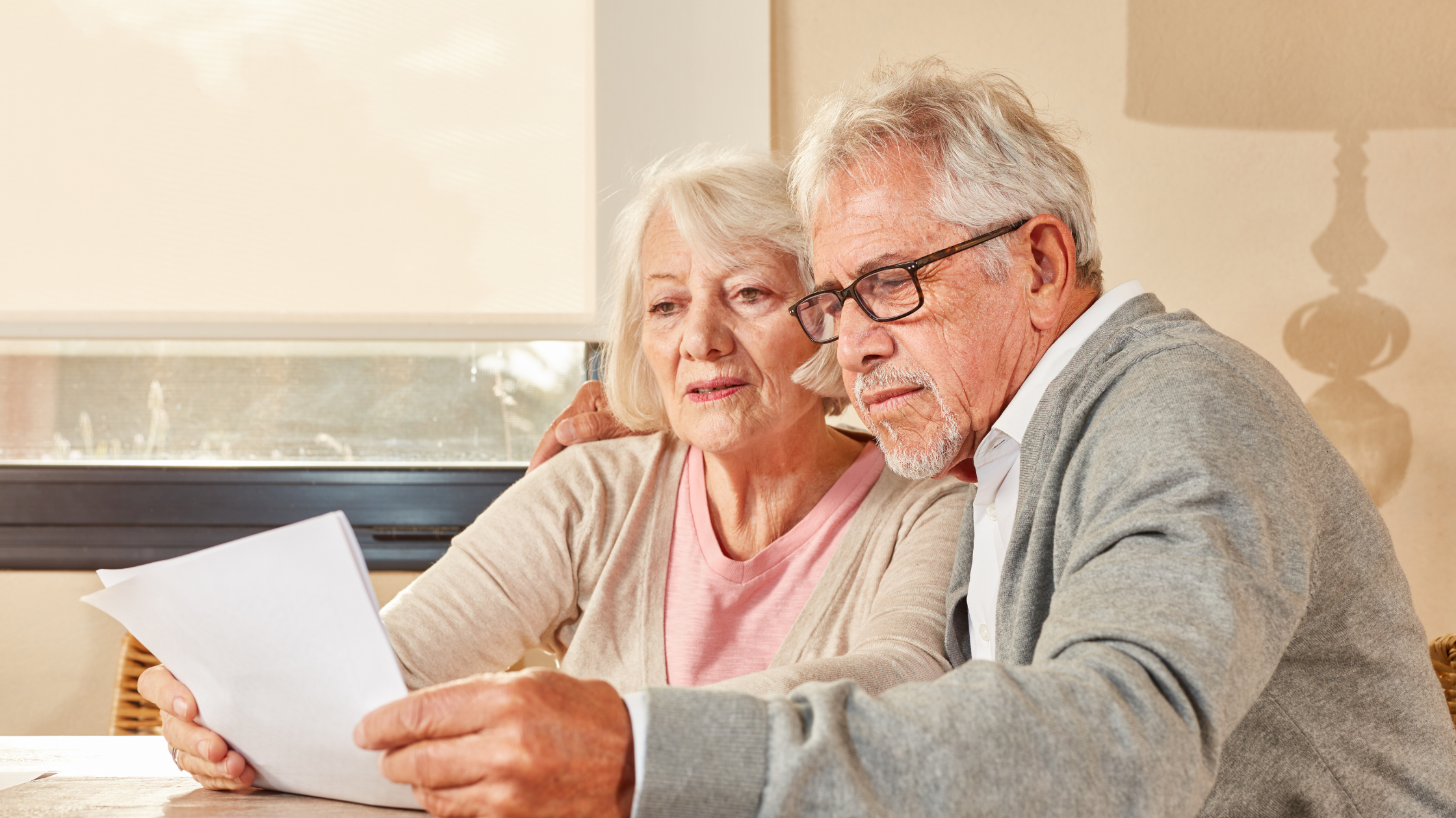 senior couple reading through documents together