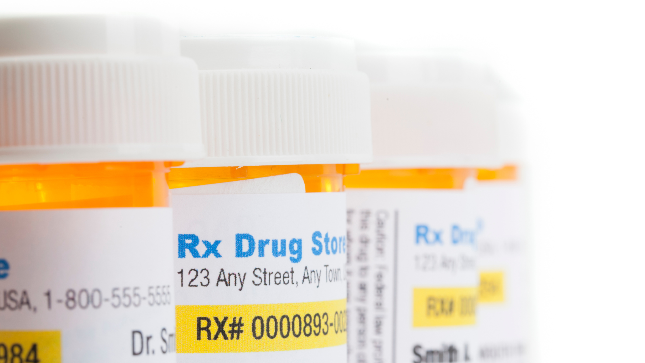 row of prescription pill bottles