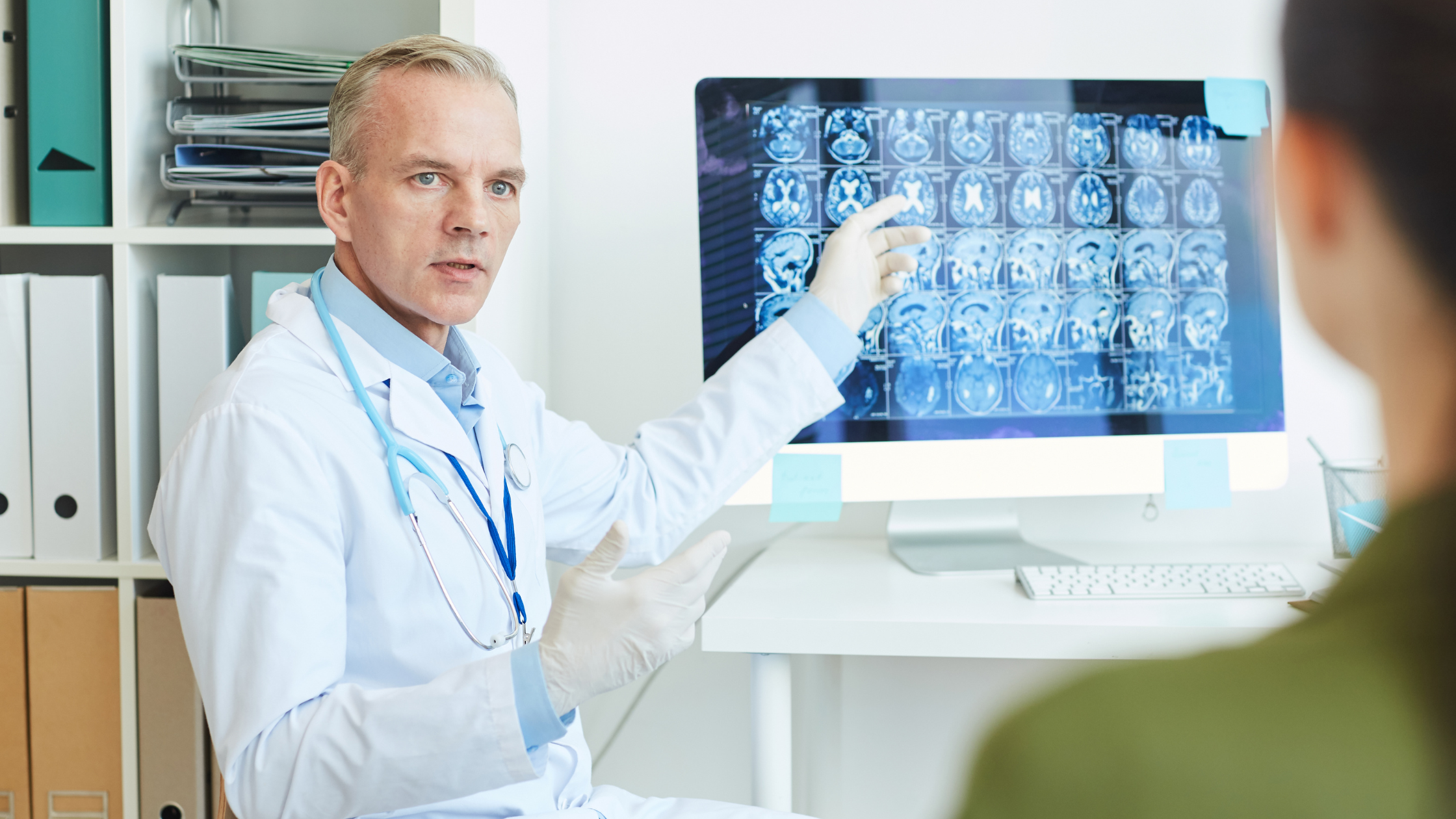 doctor explaining brain scans to a patient