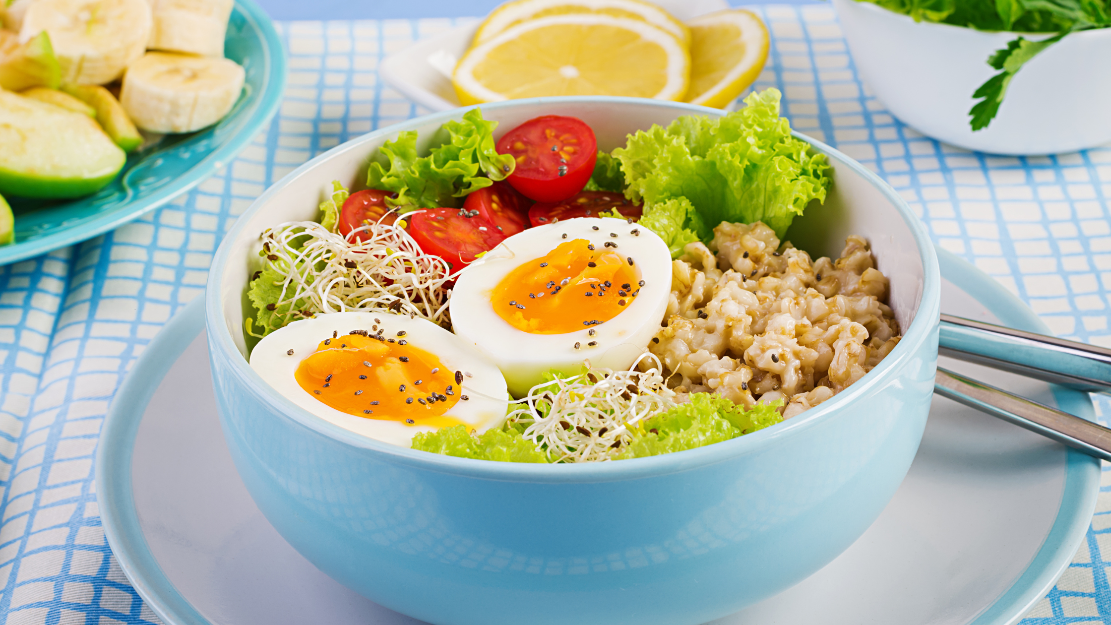 hearty breakfast bowl with oats, eggs, and veggies