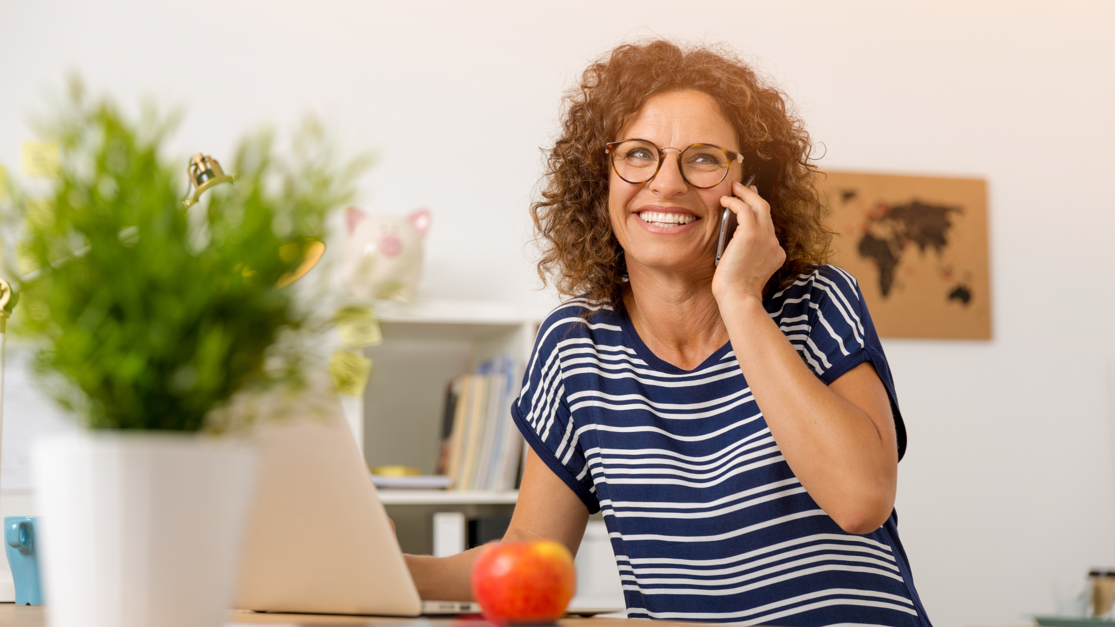 woman smiles on a phone call