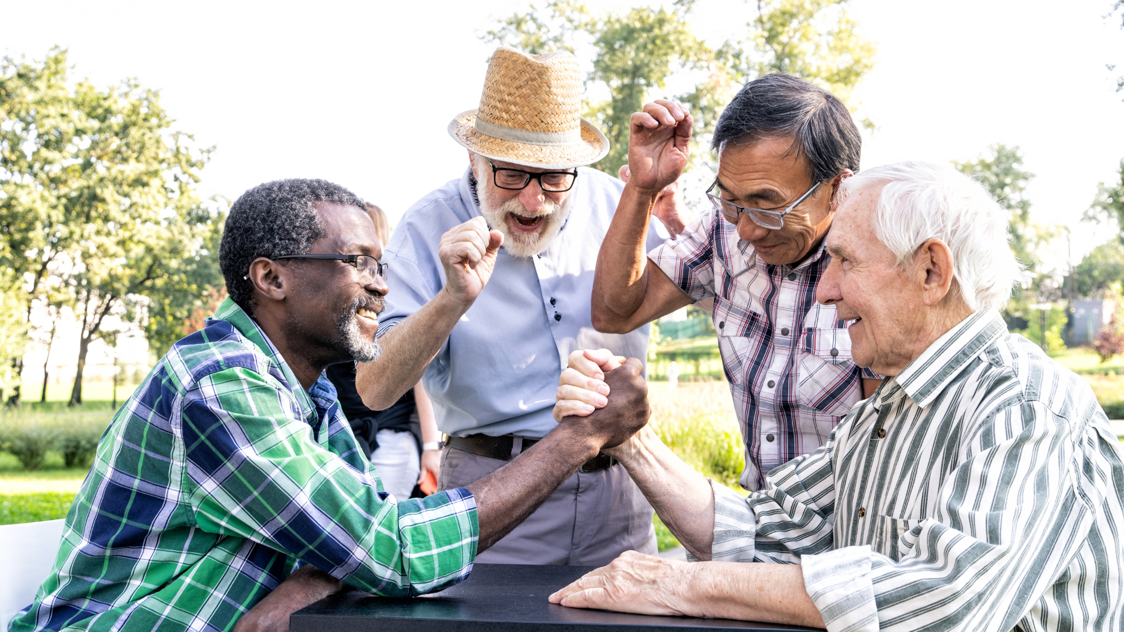 happy group of seniors in a park