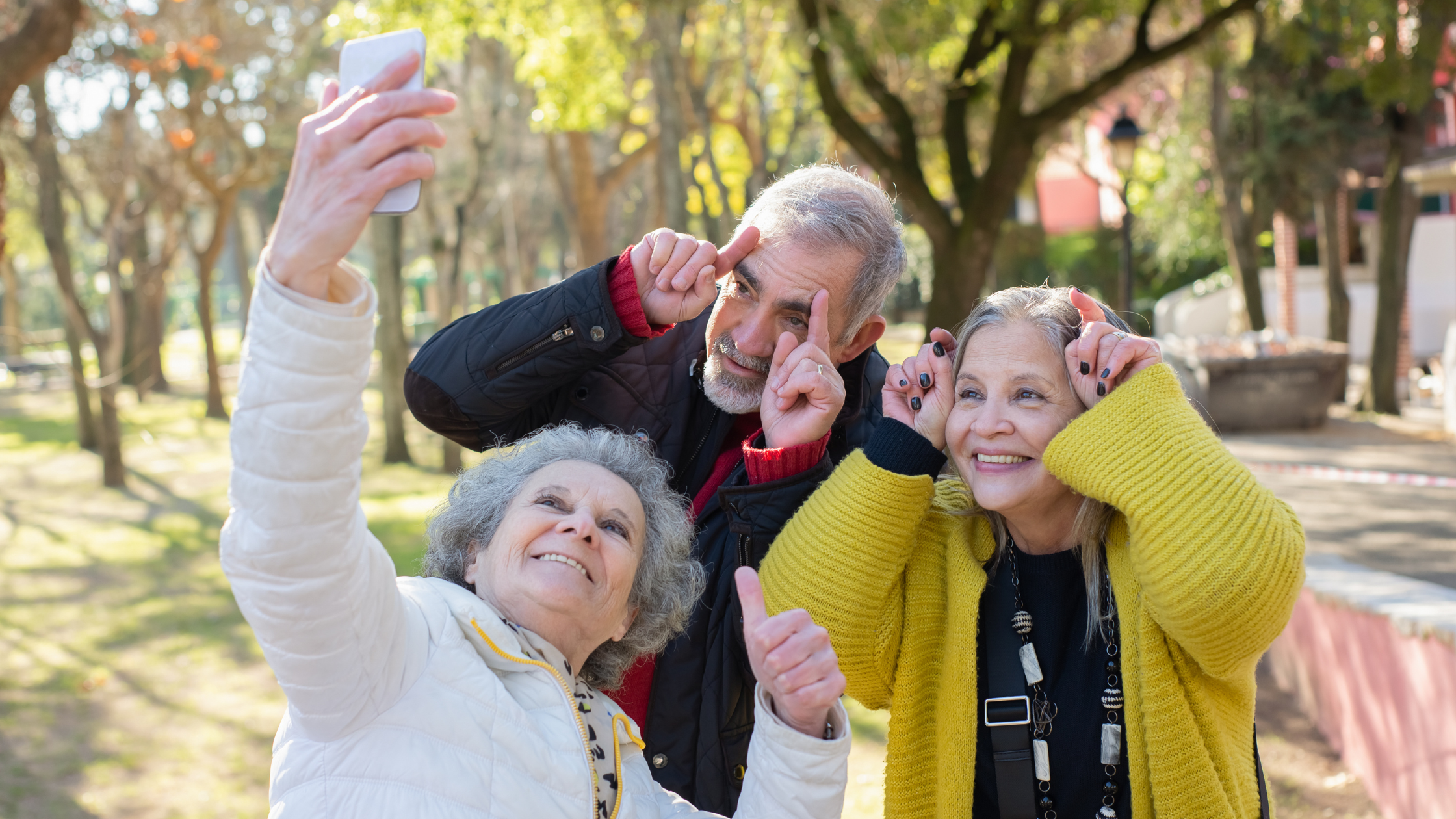 group of three happy seniors take a selfie group of three happy seniors take a selfie