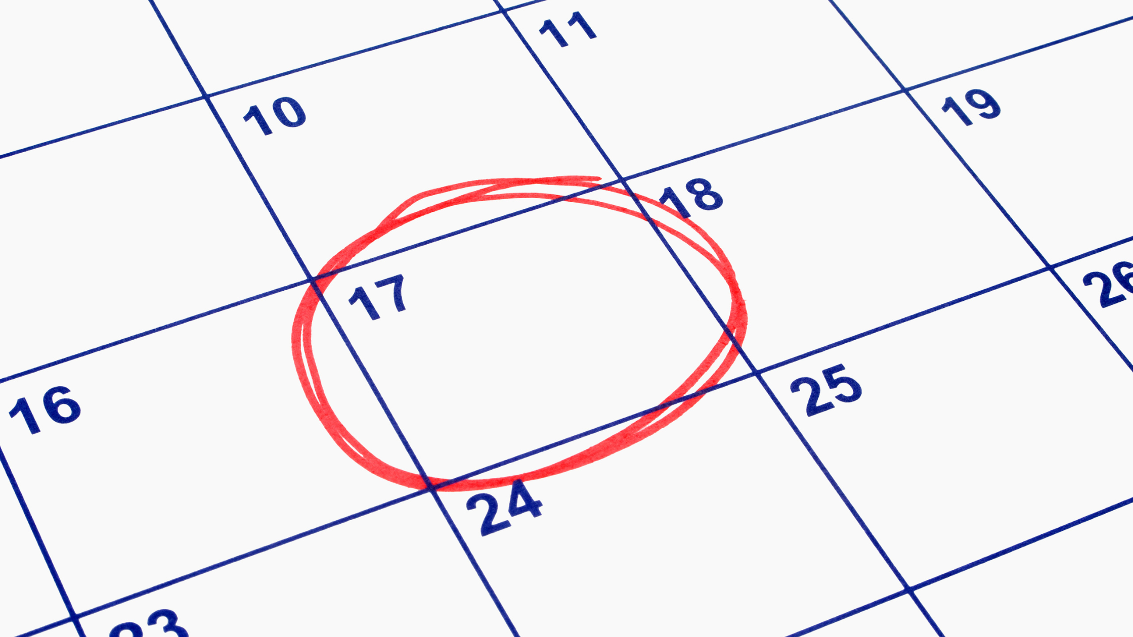 close up of a calendar with the 17th circled in red