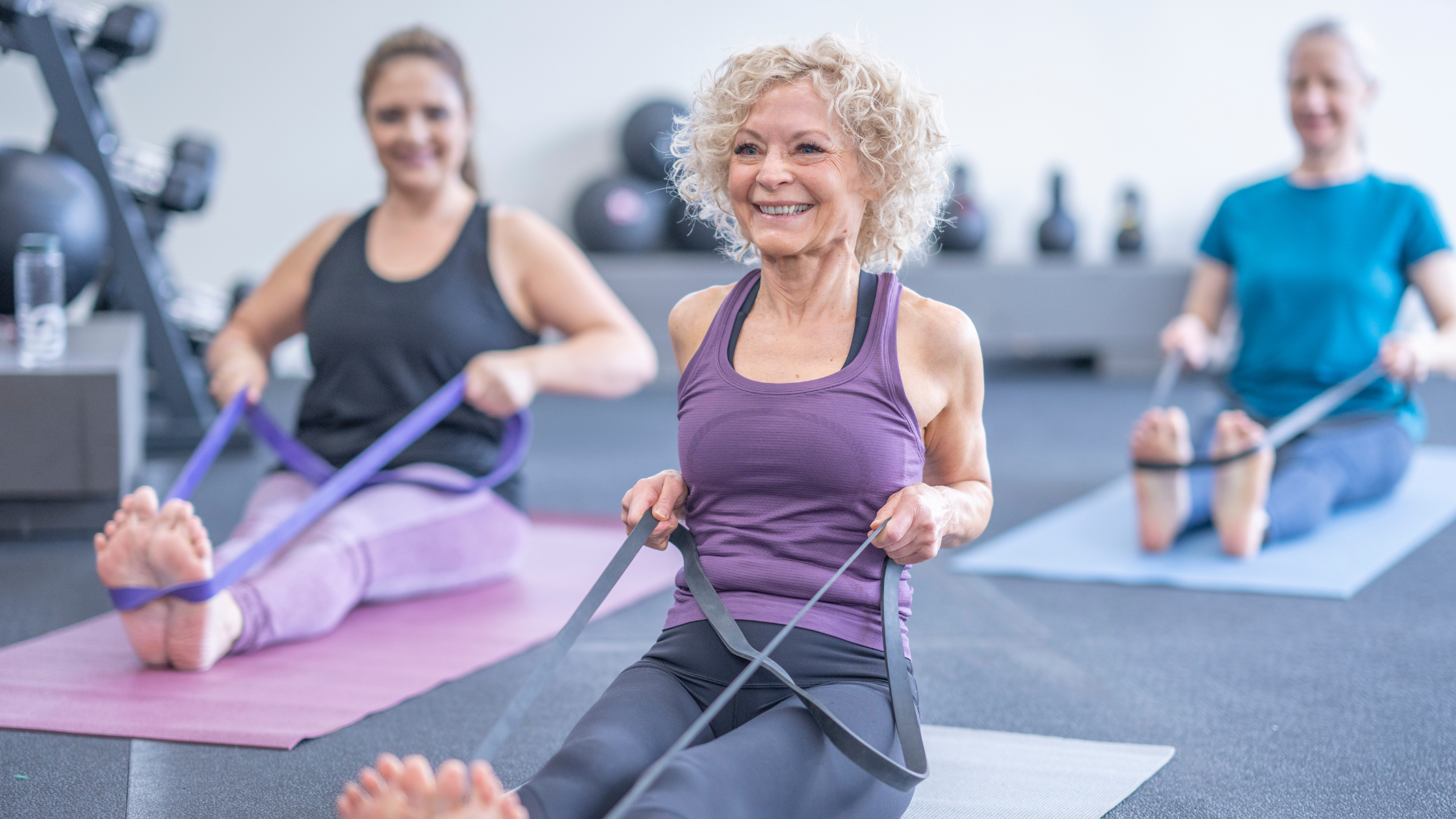 seniors in an exercise class, smiling