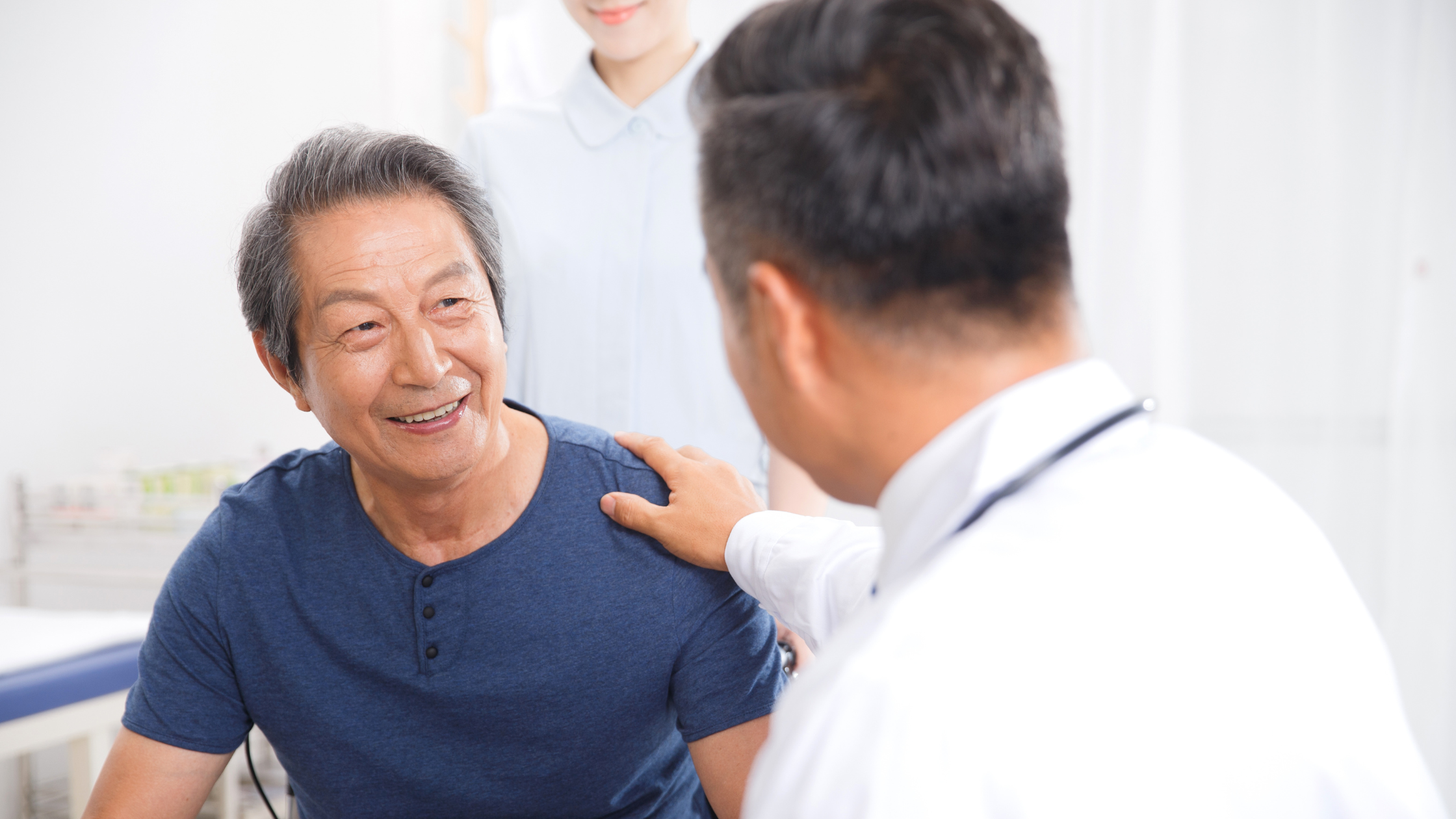 senior man chatting with male doctor