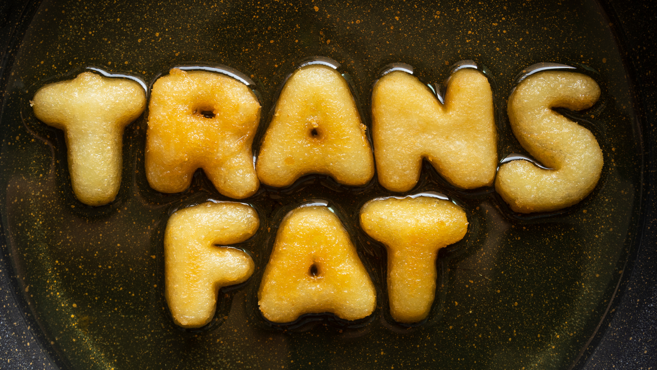 deep fried dough letters spell out "trans fat"