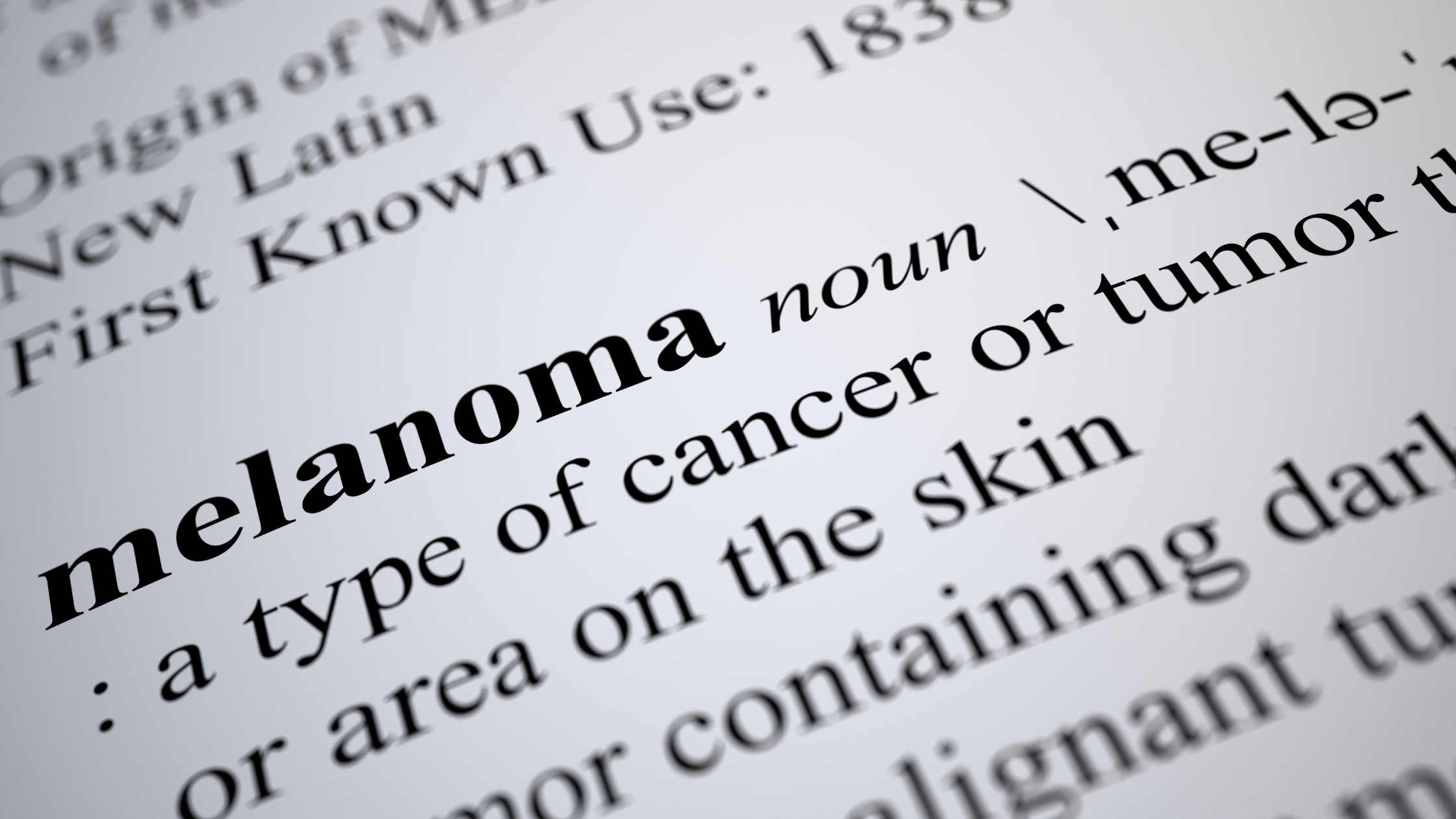 black and white dictionary definition of melanoma